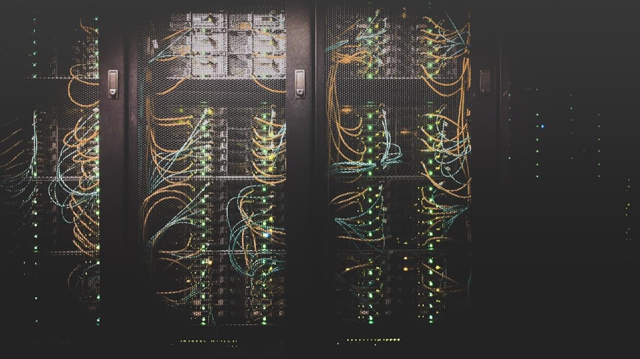 Data center showing transition from legacy mainframe to modern cloud infrastructure